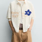 Cream Statement Shirt – Never Settle Embroidered Detail